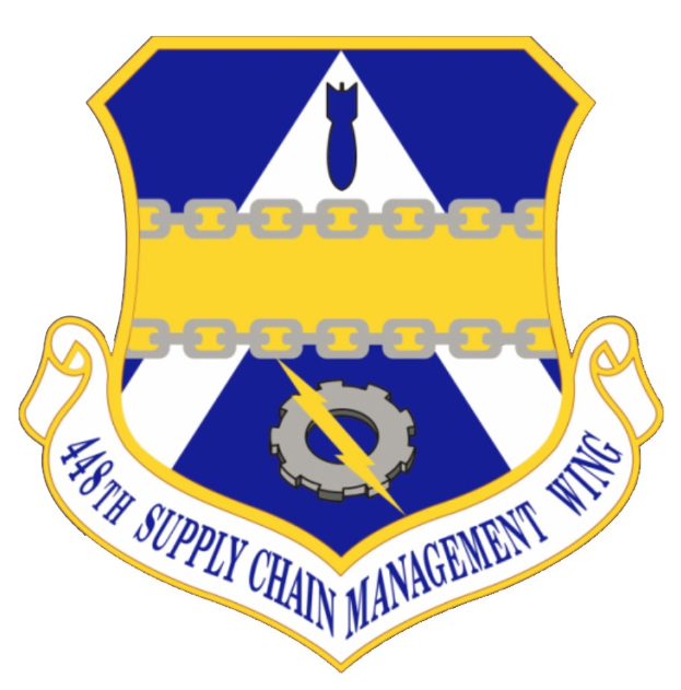 Logo der 48. Versorgungsgeschwader mit einem blauen Schild mit einem weißen Stern, einem weißen Banner mit der Aufschrift "Versorgungsgeschwader" in Blau und dem Text "48. Versorgungsgeschwader" in fetter schwarzer Schrift.