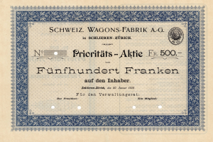 Ein altes deutsches Aktienzertifikat mit blauer Einfassung und der Aufschrift "Schweiz Wagons-Fabrik A.G."