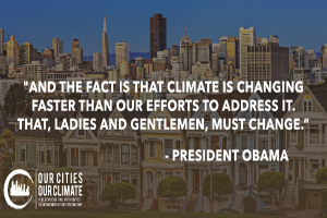 Eine Stadtansicht mit Gebäuden, Bäumen und Fahrzeugen, die einen Zitat von Präsident Obama zum Thema Klimawandel in den Vordergrund stellt, unter einem sichtbaren Himmel.