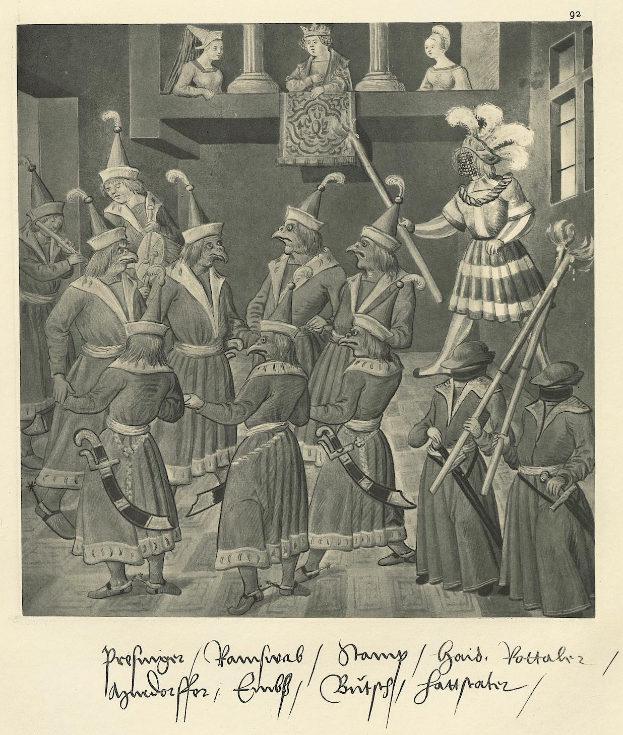 Eine Gruppe von Menschen in Kostümen mit Schwertern steht vor einer Wand mit einem Fenster auf der rechten Seite, mit Text unten lesend "profiniger pamfraal / danny / gais, pottalh 2".