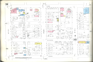 Ein altes Buch mit einer Stadtkarte aus den 1920er Jahren, die Straßen, Parks und Sehenswürdigkeiten zeigt.